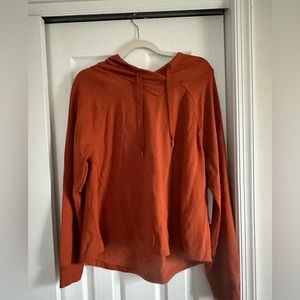 A light weight burnt orange pullover perfect for nights at beach in the summer!